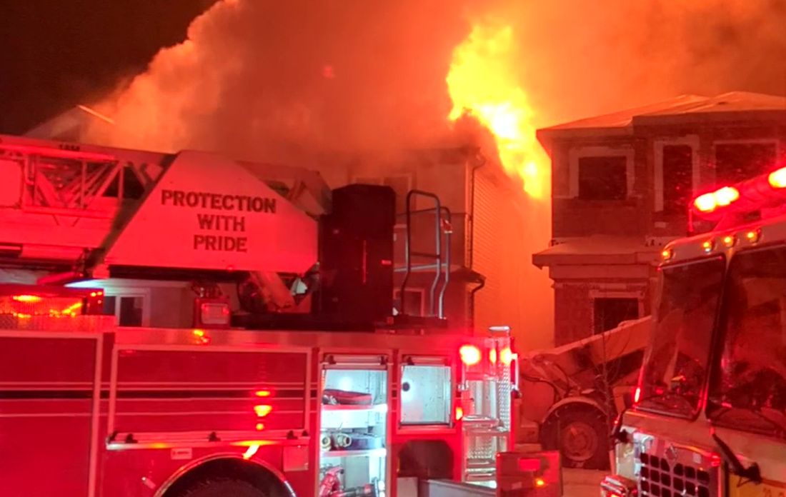 Photo of crews battling a house fire in Beaumont, Alta., on Jan. 16, 2024.
