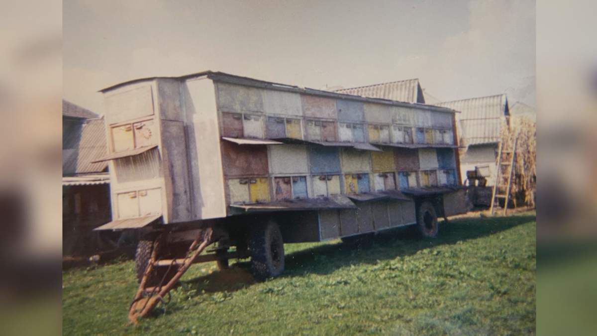 A large wooden structure on a moveable trailer.