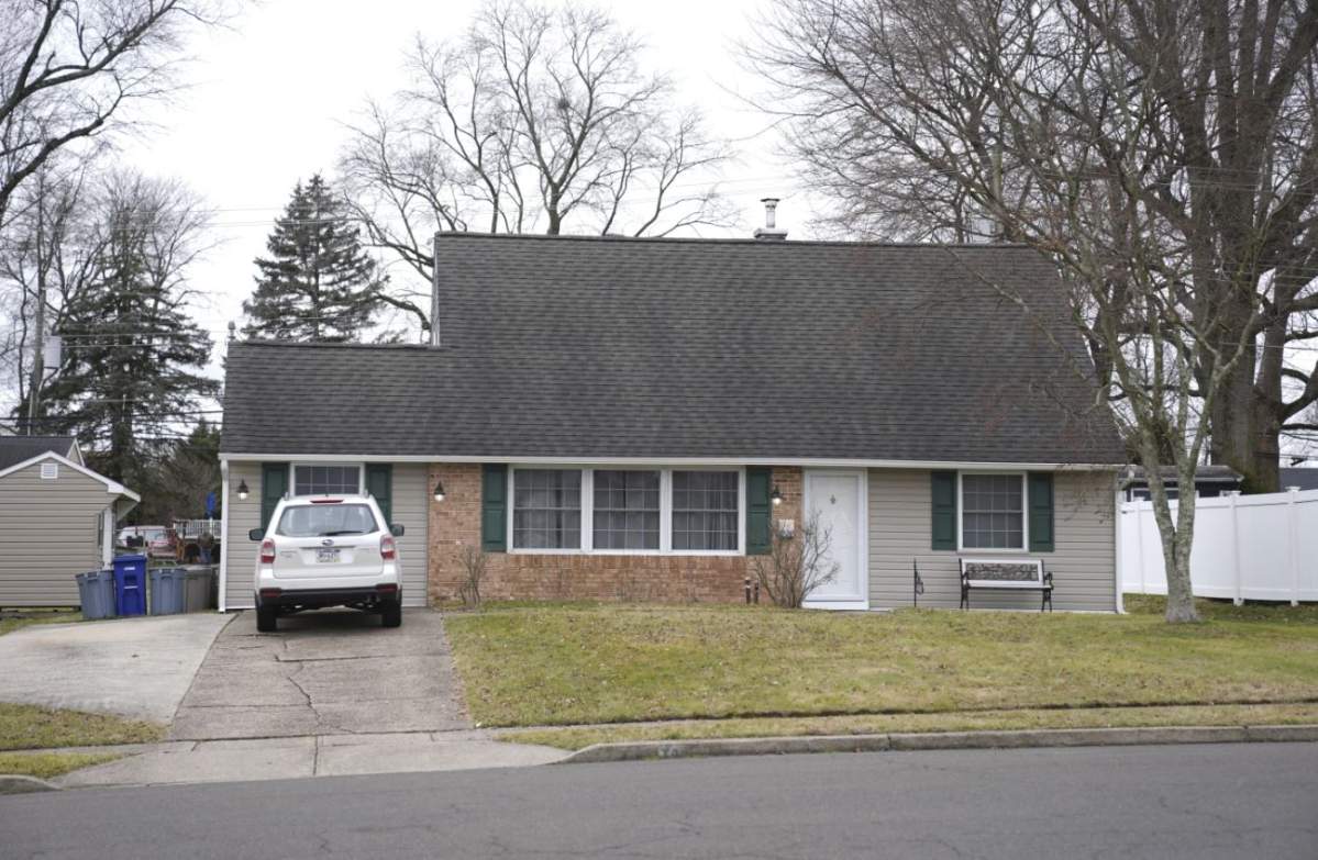 A vehicle is parked in the driveway of the home that was the scene of the decapitation in Levittown, Pa.