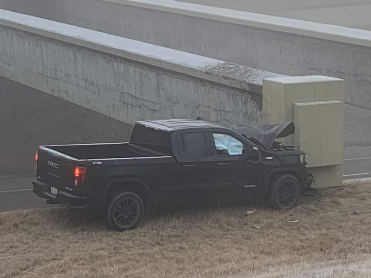 Police are investigating a collision that sent two people to hospital Thursday morning after a truck collided with a concrete pillar on Anthony Henday Drive.