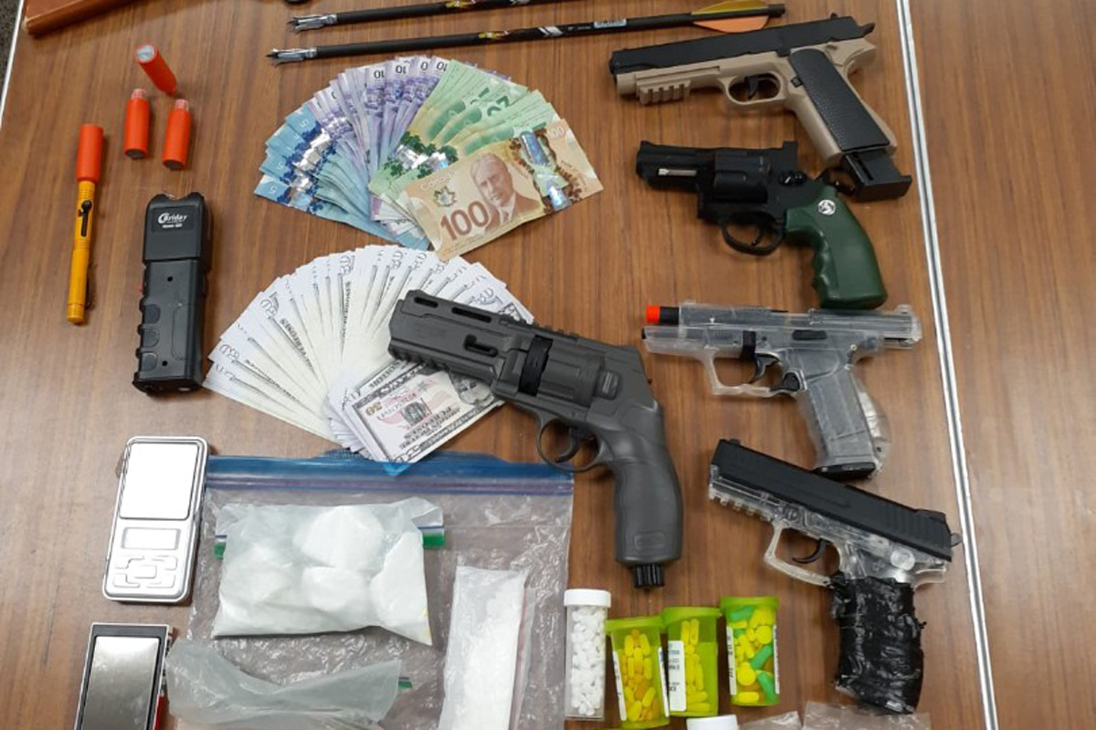 Police seized drugs, money, airsoft guns and arrows during the raid.