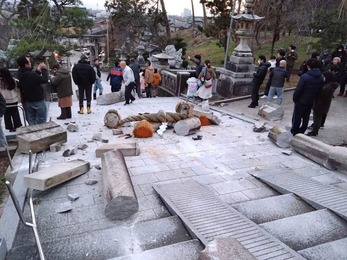 A torii gate is damaged after an earthquake at a shrine in Kanazawa, Ishikawa prefecture, Japan Monday, Jan. 1, 2024. Japan issued tsunami alerts Monday after a series of strong quakes in the Sea of Japan.