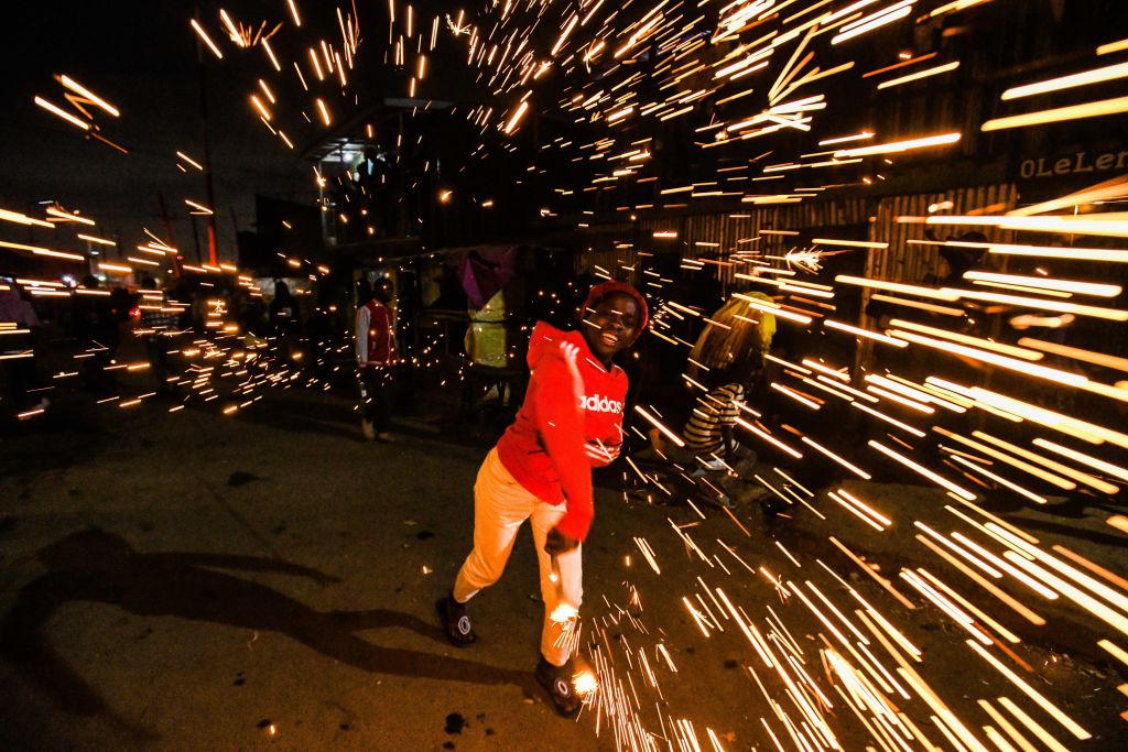 NAIROBI, KENYA – DECEMBER 31: Children celebrate the new year with gerbs in Nairobi, Kenya on December 31, 2023.