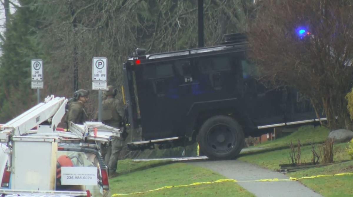 ERT members respond to a police incident in North Vancouver on Friday. 