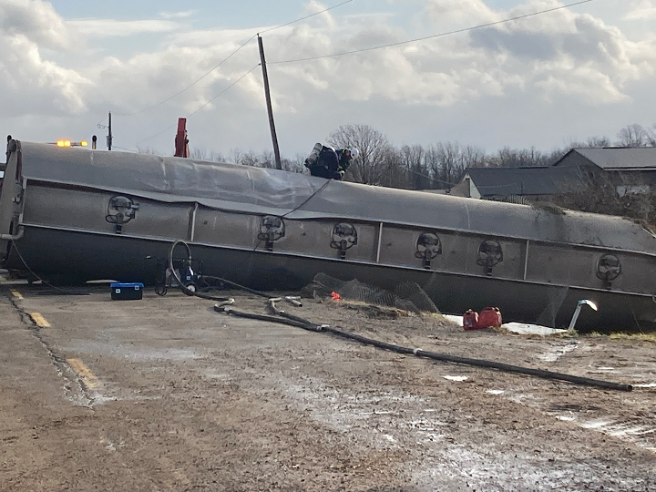 Emergency services are working to remove fuel from the tanker that rolled over after Friday’s collision.