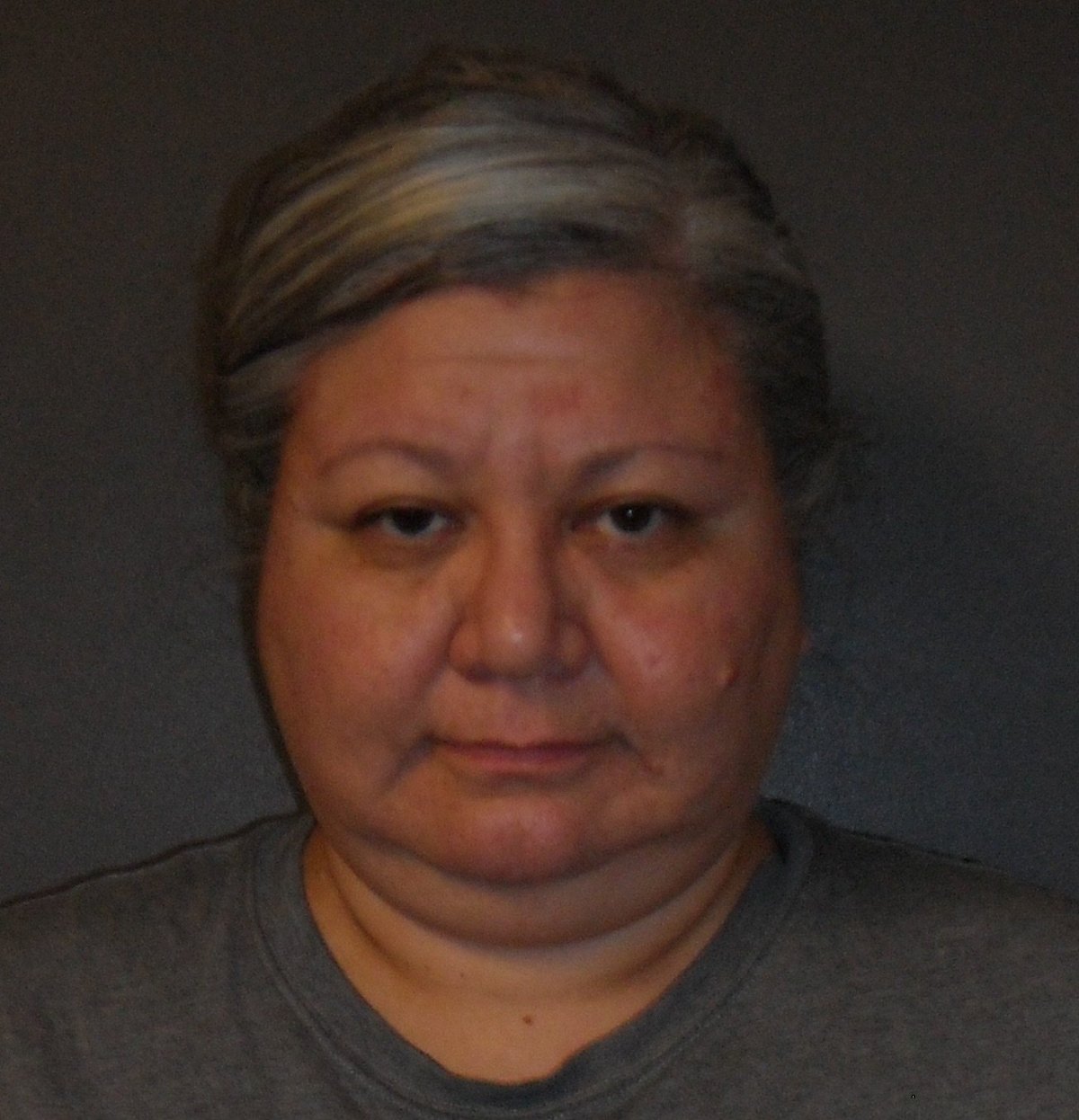 Michelle Babette Lawrence, 48, is described as an aboriginal female, approximately 5’8” tall and around 200 lbs. She has brown hair and brown eyes, with descriptive features such as a mole on her left eyelid and left cheek.