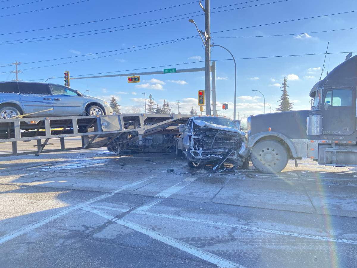 Collision between a pickup truck and the flat deck trailer at the intersection of 170 Street and 118 Avenue on Feb. 9, 2024.