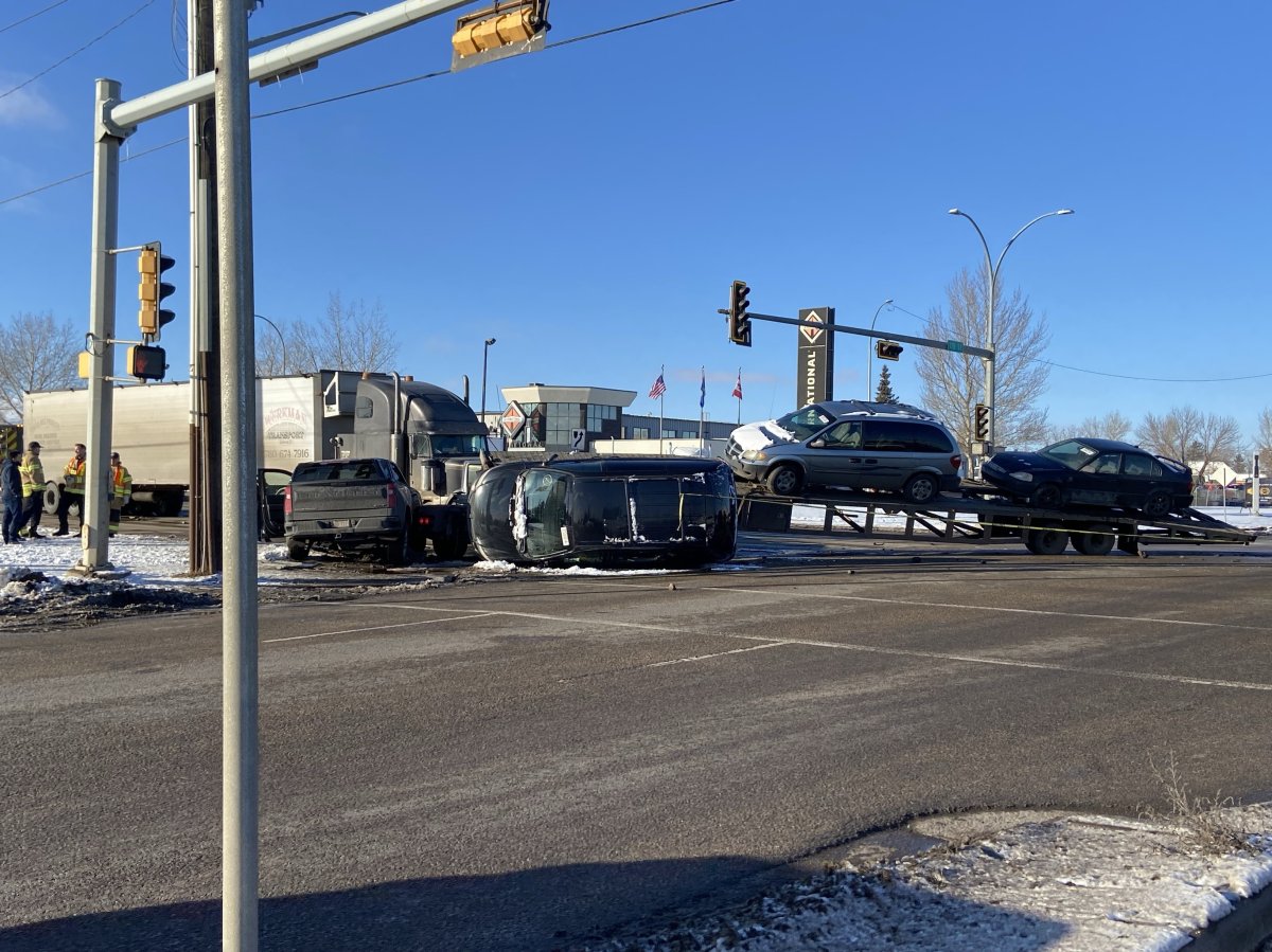 Collision between a pickup truck and the flat deck trailer at the intersection of 170 Street and 118 Avenue on Feb. 9, 2024.