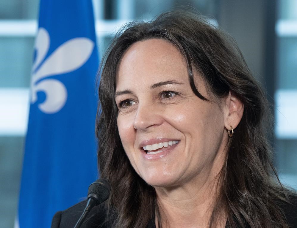 Quebec Sports Minister Isabelle Charest is seen as she speaks to members of the media.