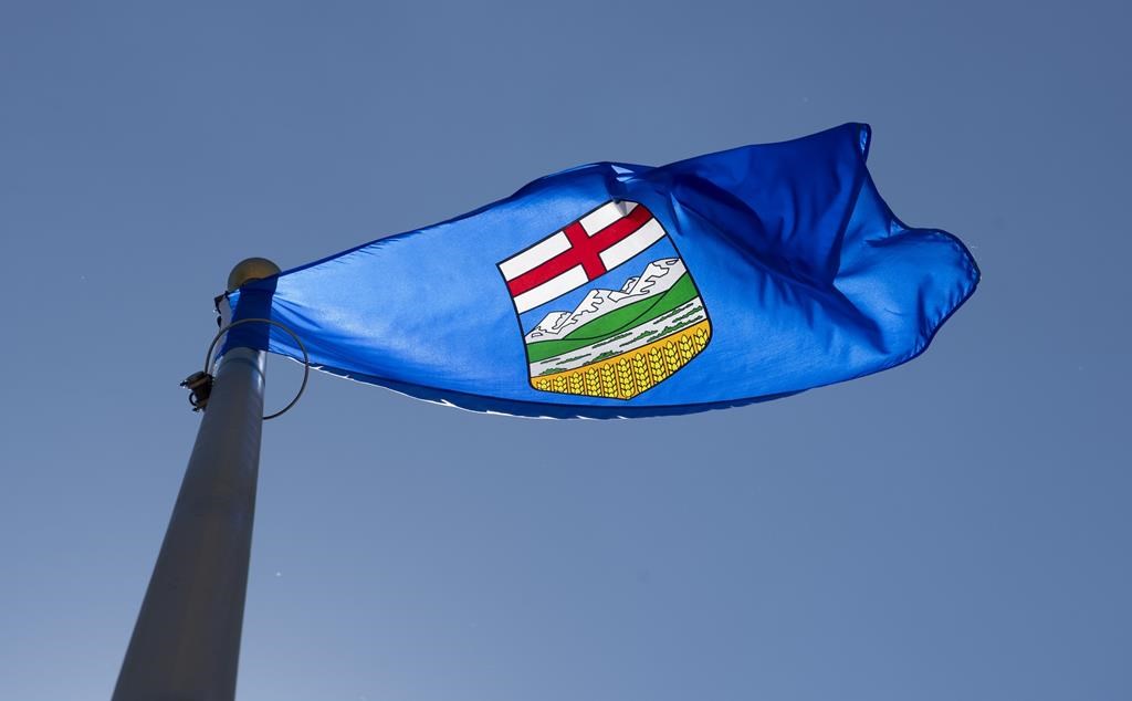 An Alberta power generator has been fined for running a power plant without regulatory approval. Alberta's provincial flag flies in Ottawa, Monday July 6, 2020.