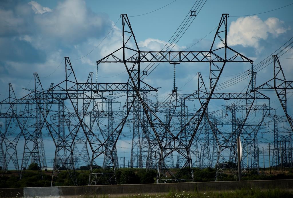 Hydro One Ltd. reported $181 million in fourth-quarter net income attributable to common shareholders as its revenue edged higher compared with a year earlier. Rows of power lines are shown in Mississauga, Ont., on Monday, August 19, 2019. 