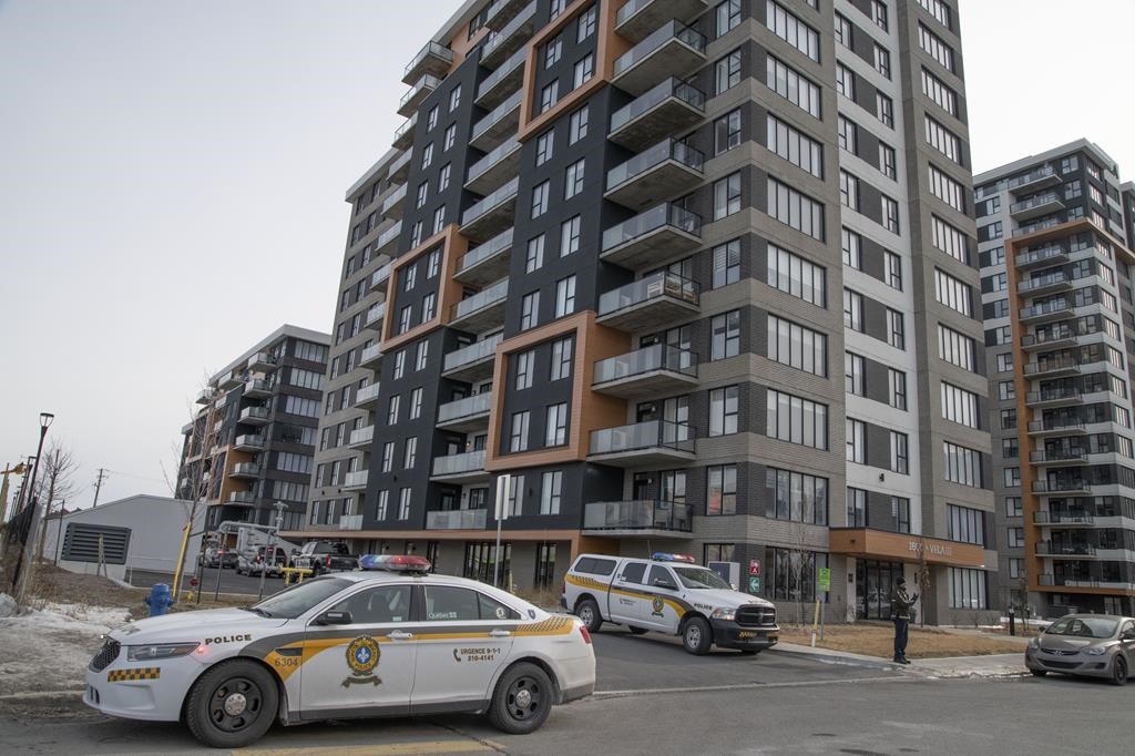 Surete du Quebec police outside an apartment in Vaudreuil-Dorion, Que., west of Montreal, where multiple people were stabbed, Thursday, Feb. 15, 2024.