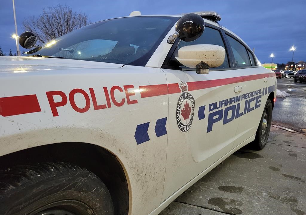 Officers were called to the scene of the crash around 2:15 p.m. Saturday. A Durham Regional Police car is shown at a Bowmanville, Ont. shopping centre parking lot on Tuesday Feb. 28, 2023. 