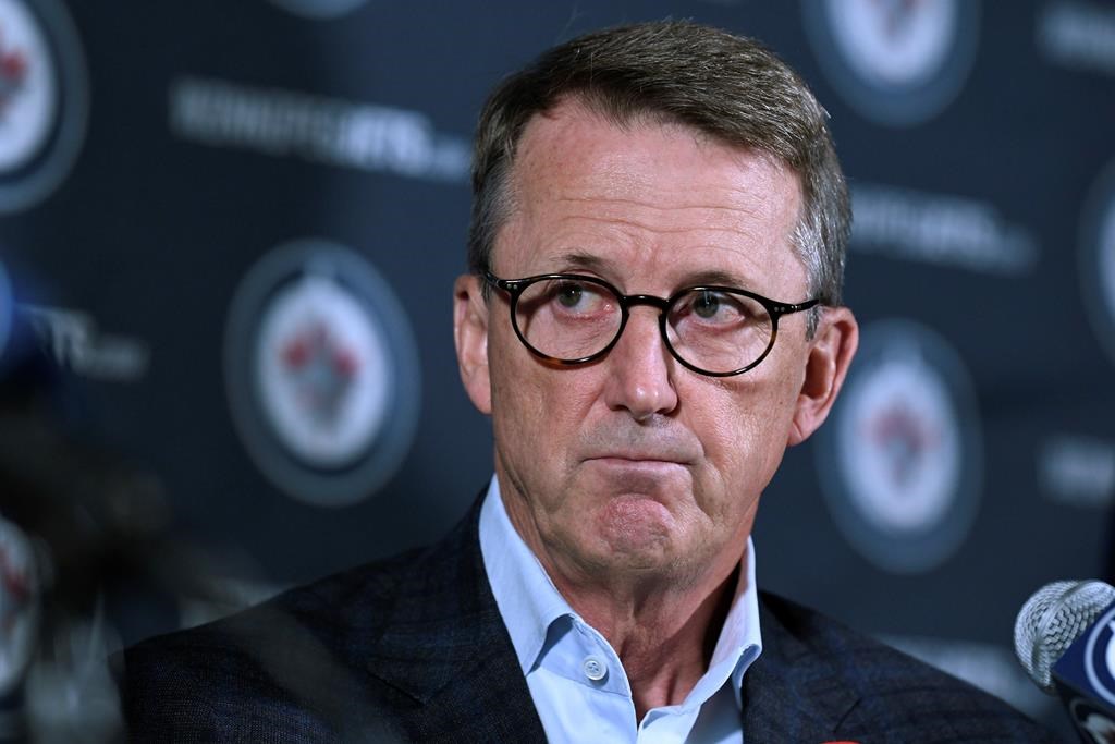 Winnipeg Jets chairman Mark Chipman says the NHL team's future could be in jeopardy if attendance doesn't improve. Chipman listens to General Manager Kevin Cheveldayoff's response to a question during a press conference in Winnipeg, Tuesday, Nov. 2, 2021. THE CANADIAN PRESS/Fred Greenslade.