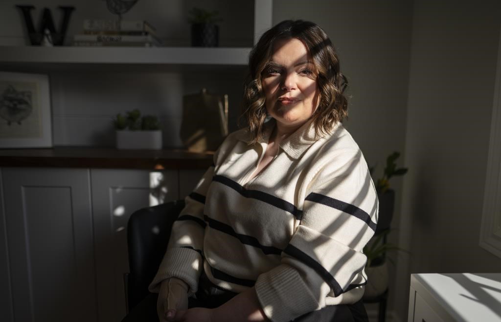 Kirsten Watson, at her home in Waterloo, Ont. on Friday, Feb. 23, 2024. She was weeks away last year from losing access to potentially life-saving medication, a situation she found herself in because Ontario does not cover the cost of take-home cancer drugs. THE CANADIAN PRESS/Peter Power.