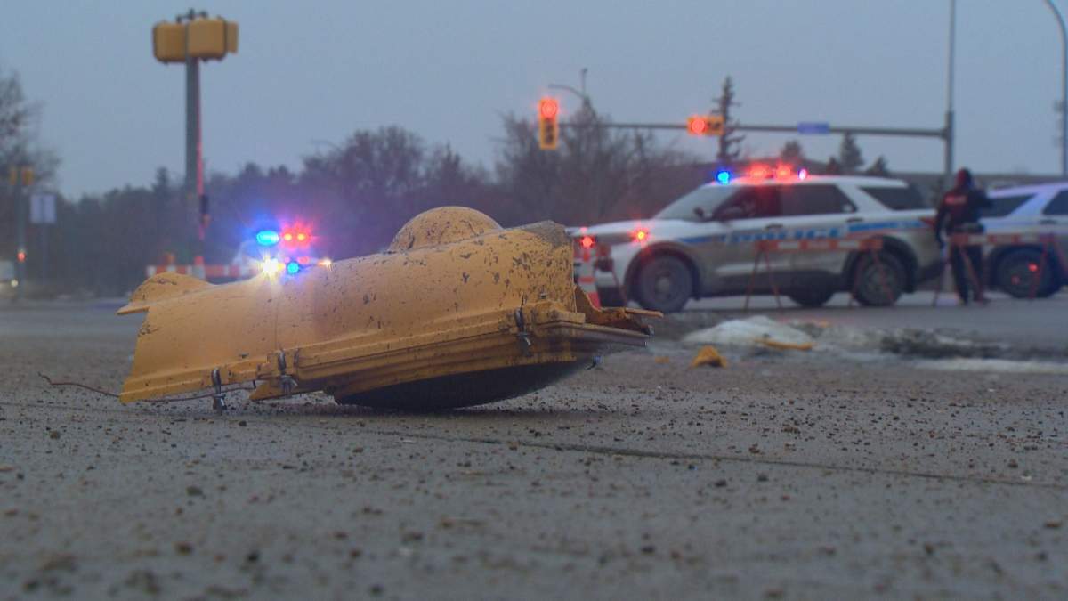 Pieces of the light post could be seen scattered across the street and sidewalk.