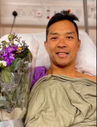 Christopher Won in the hospital in Hong Kong.