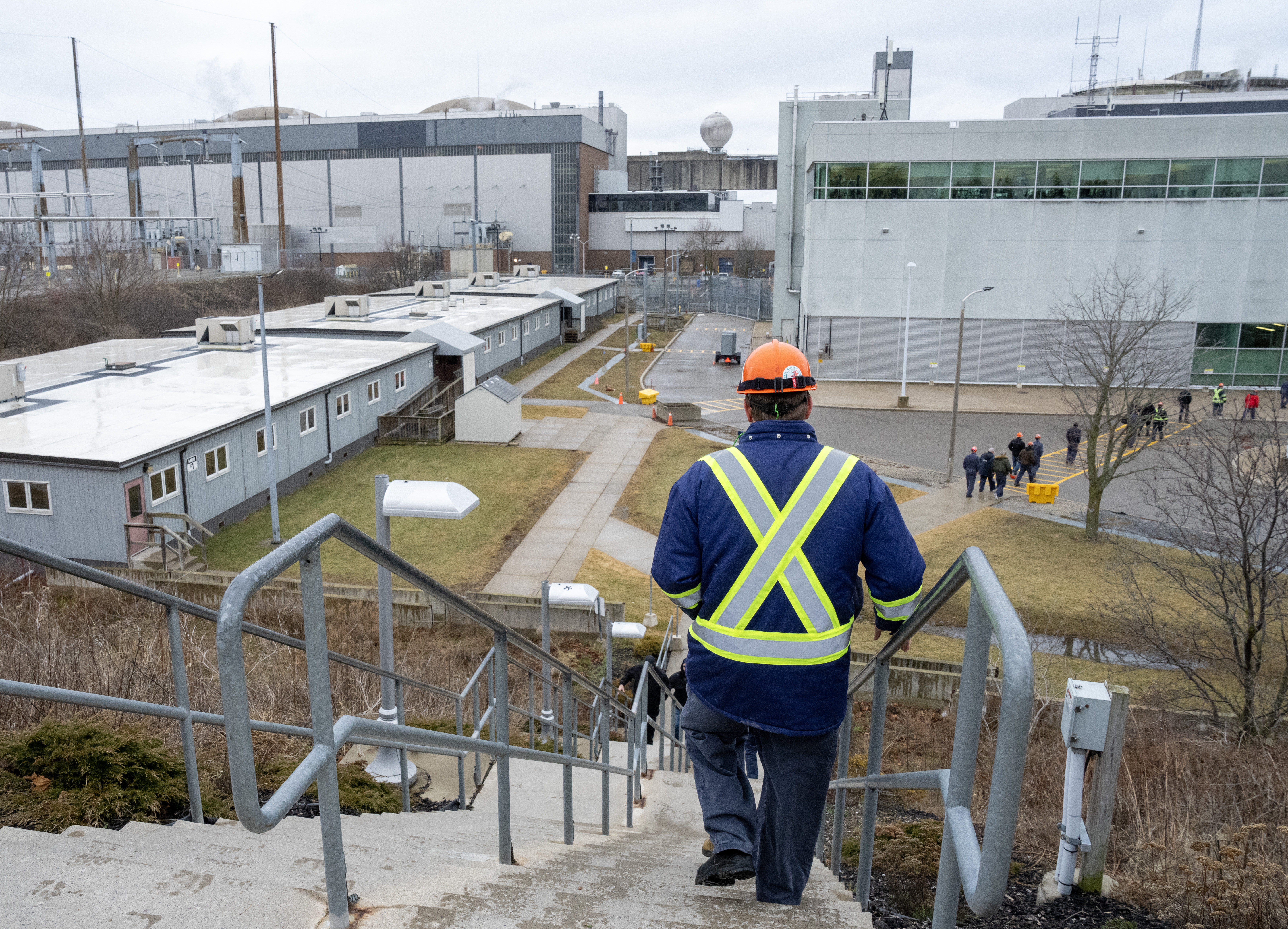 Workers return to the plant after a news conference at the Pickering Nuclear Generating Station in Pickering, Ont., Tuesday, Jan. 30, 2024. THE CANADIAN PRESS/Frank Gunn