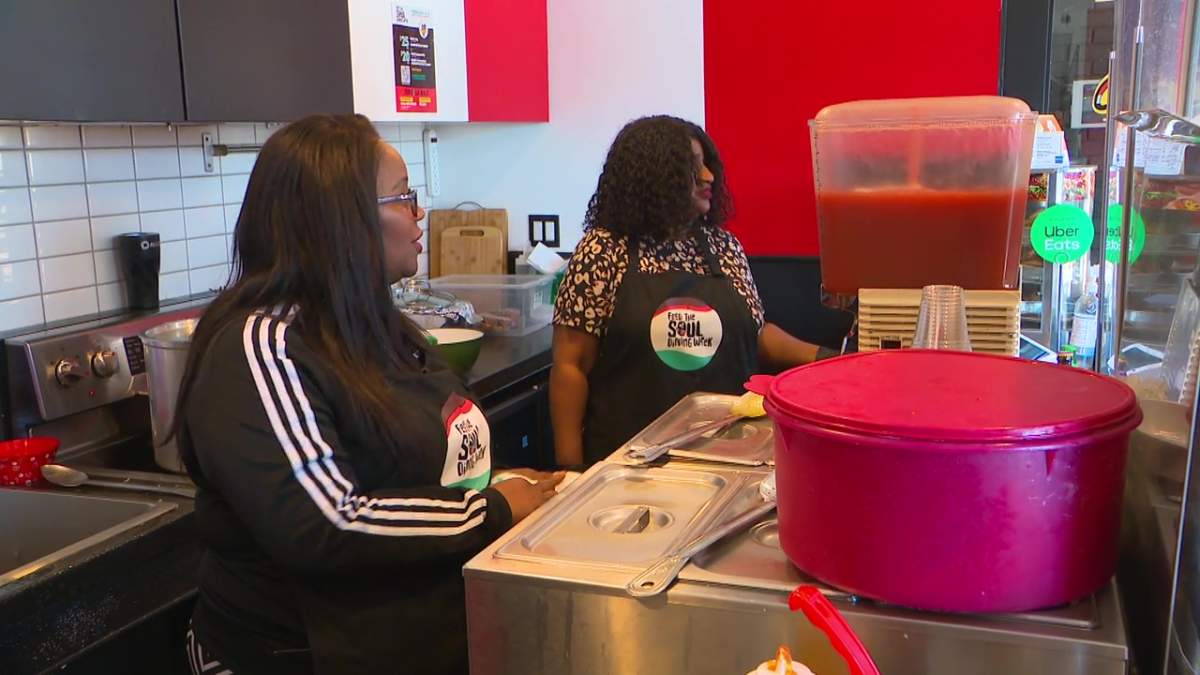 Cafe Caribbean (10140 117 St.) owner Nadine Lewis and her cousin Patricia serving food from Trinidad in downtown Edmonton.