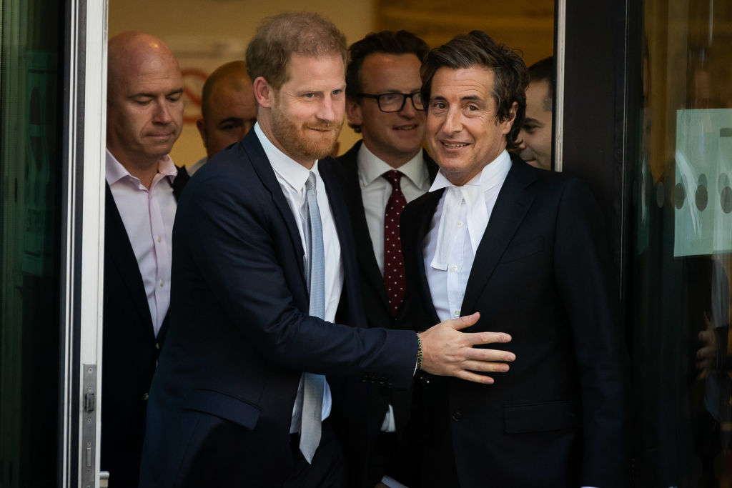 Prince Harry and his lawyer are seen leaving court.