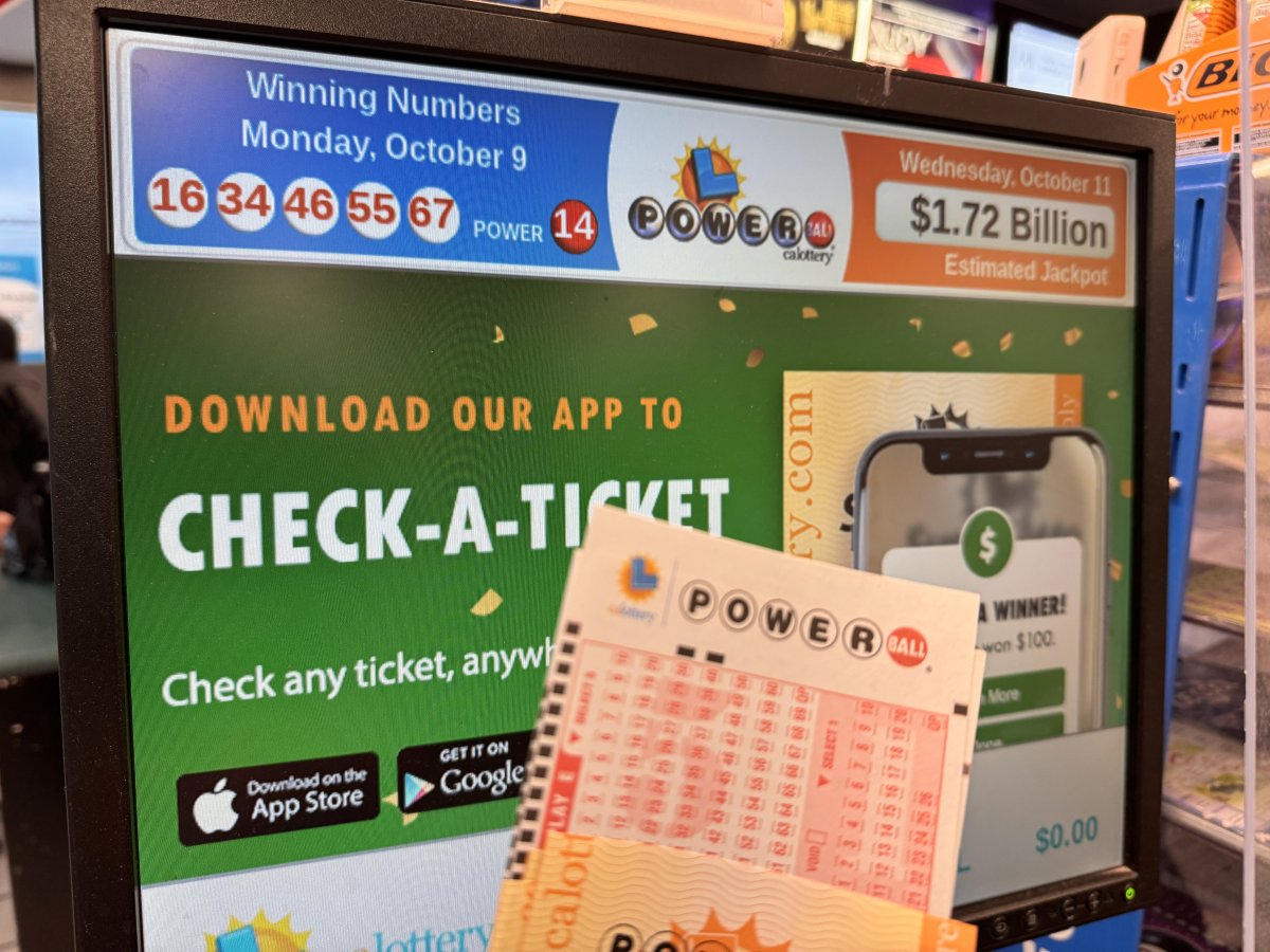 Powerball ticket in front if the winning numbers.