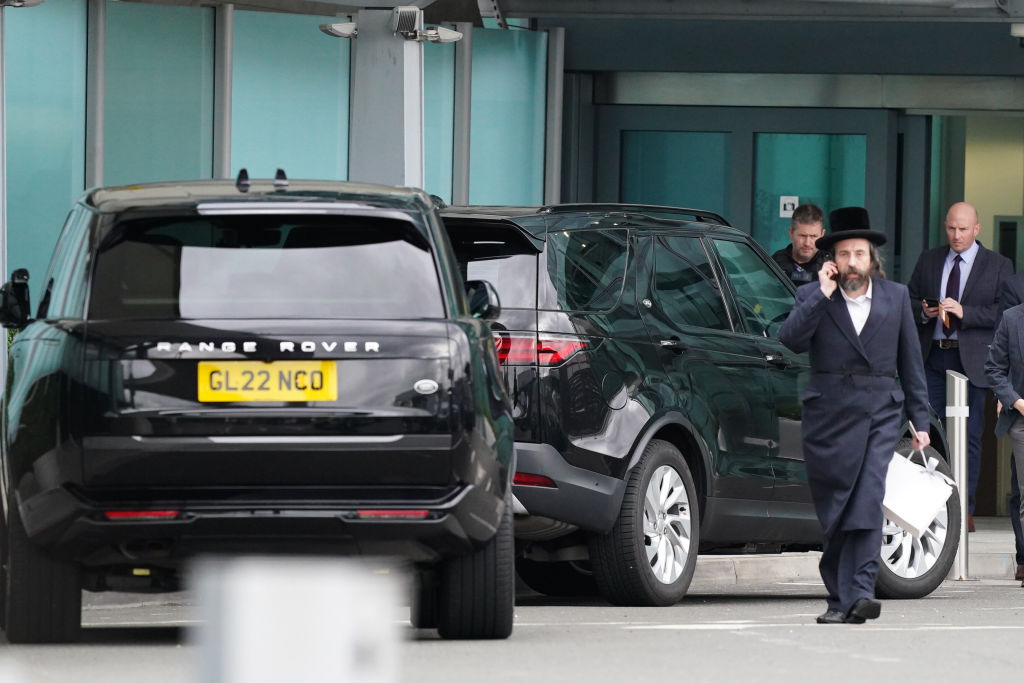 Two black SUVs wait outside the Windsor Suite at Heathrow Airport, London, ahead of the arrival of the Duke of Sussex who is travelling to the U.K. from Los Angeles following the announcement of King Charles III’s cancer diagnosis on Monday evening.