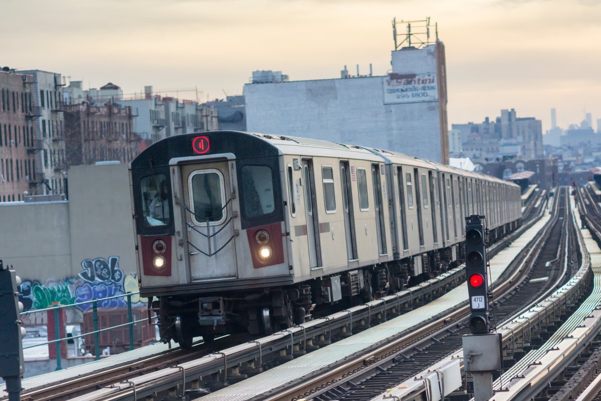 An above-ground subway travels on train tracks in the Bronx.