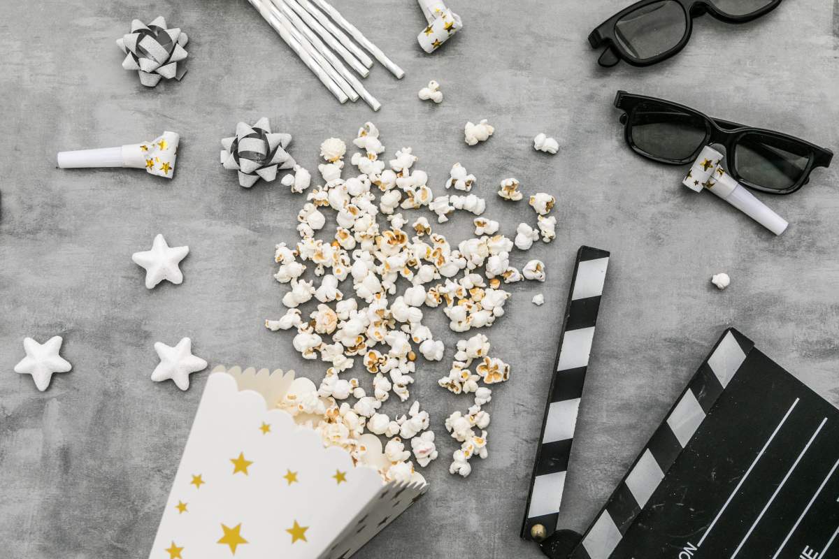 popcorn boxes , 3d glasses, clapper board, on bright background