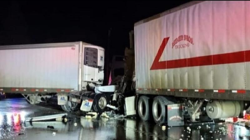 The wreckage of two semi-trucks that collided on Highway 97 near Kamloops, B.C., on Monday, Feb. 12, 2024.