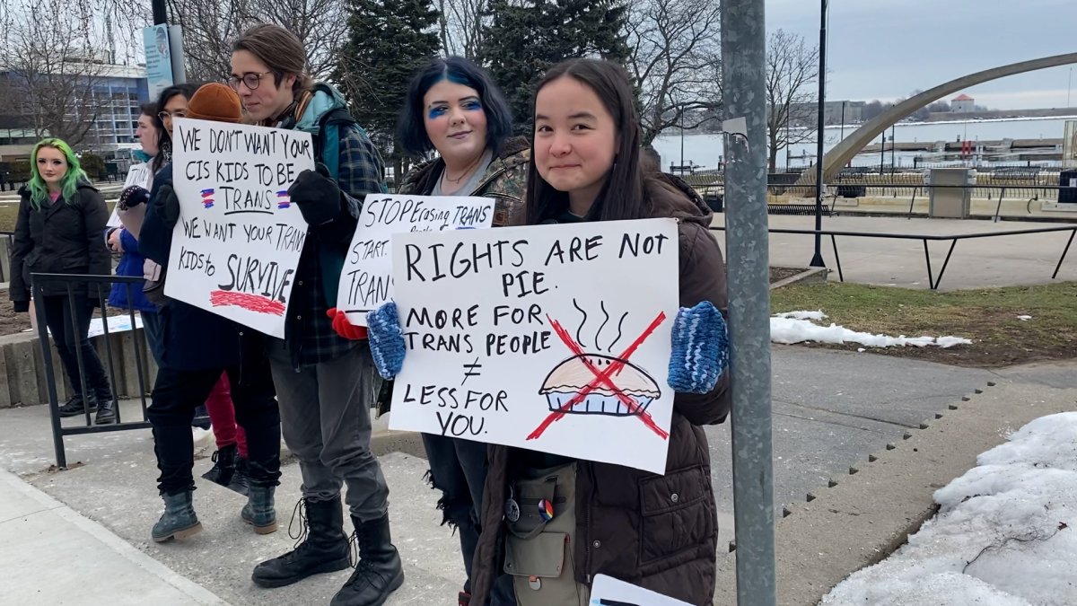 Students and supporters held a rally outside Kingston city hall Wednesday to protest against Alberta’s controversial gender identity policies.