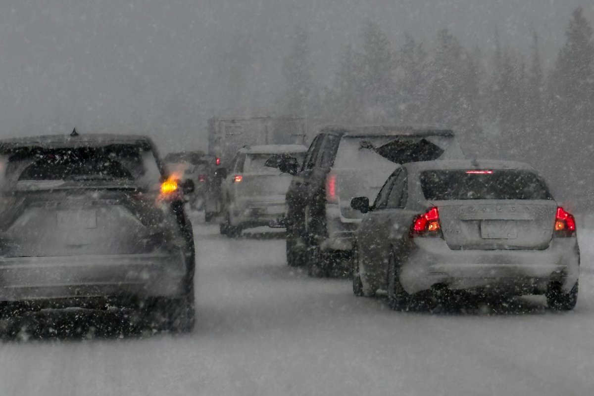 Snow conditions brought traffic to a half along a portion of the Trans-Canada Highway west of Calgary on Thursday, February 29, 2024.