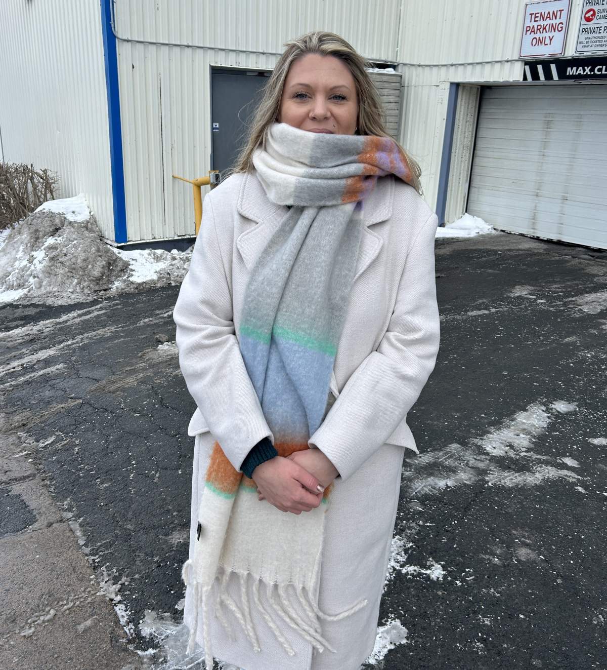Sunny Tinkler stands outside the parking garage underneath her apartment complex on Thursday.