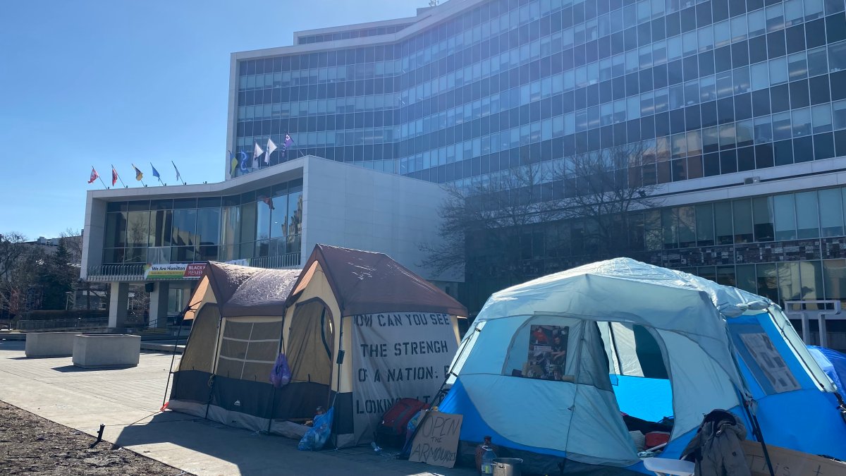 Poverty advocates pitched tents Feb. 26, 2024 in front of Hamilton city hall's forecourt. The demonstration is in response to a council vote that opted to leave a pair of parking lots in Stoney Creek out of plan to build affordable housing.