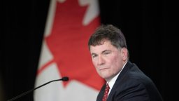 Minister of Public Safety Dominic LeBlanc is shown in front of a Canadian flag