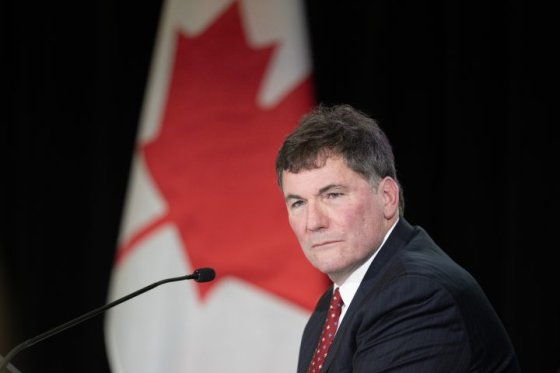 Minister of Public Safety Dominic LeBlanc is shown in front of a Canadian flag