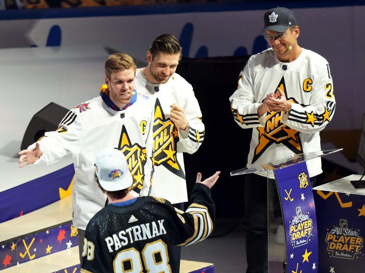 Connor McDavid (left) of Team McDavid picks David Pastrnak as Leon Draisaitl and Will Arnett (right) look on during the NHL All-Star week draft in Toronto on Thursday, February 1, 2024.