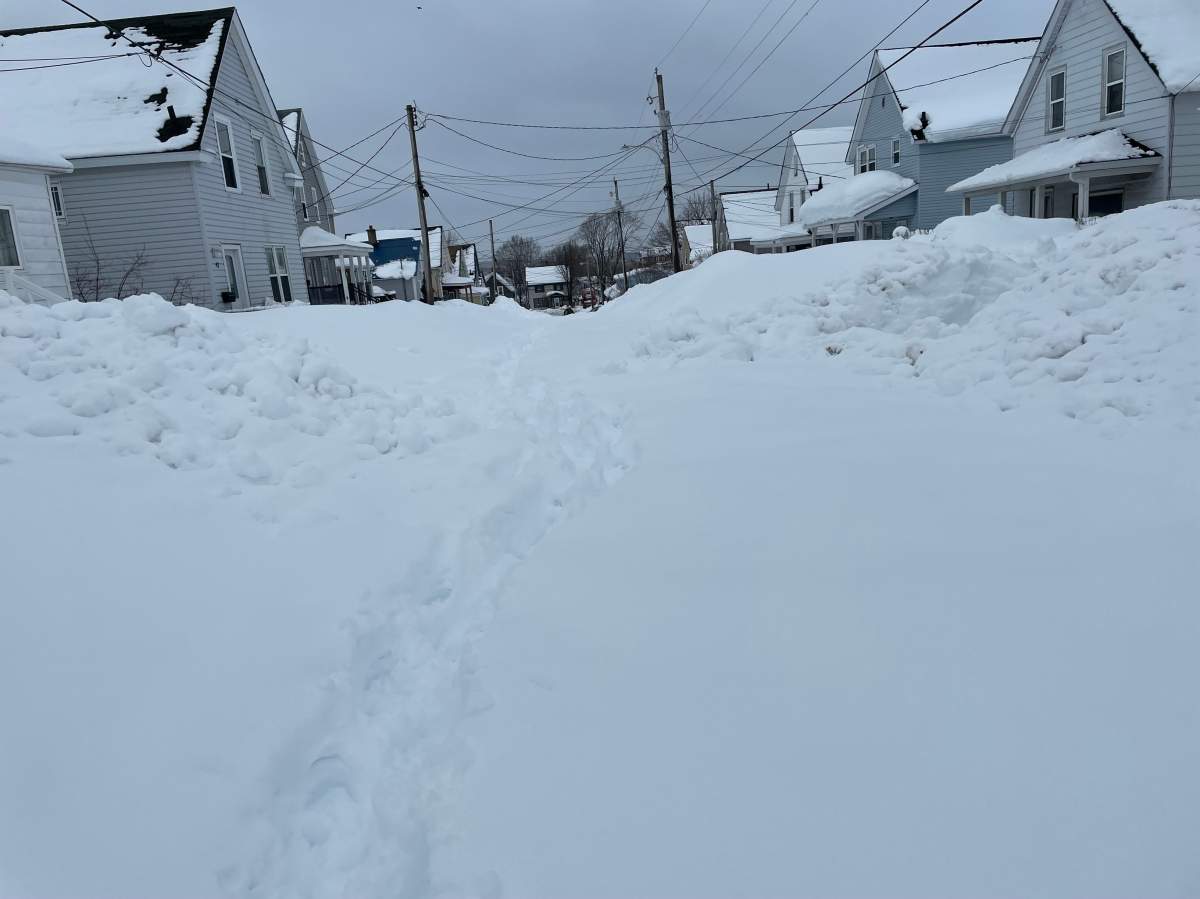 Many houses remain blocked off days after the snowfall.
