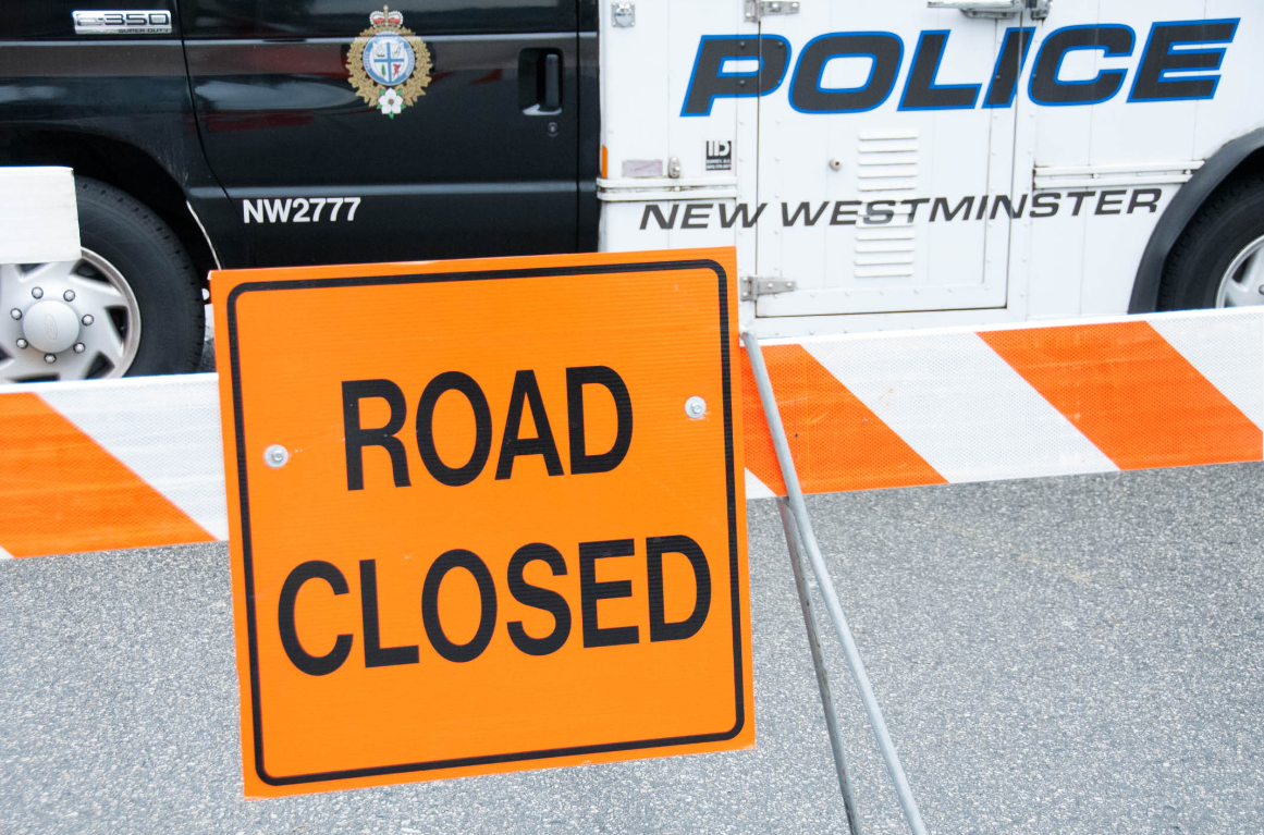 A road closure sign is seen next to a New Westminster Police Department cruise in an undated file photo.