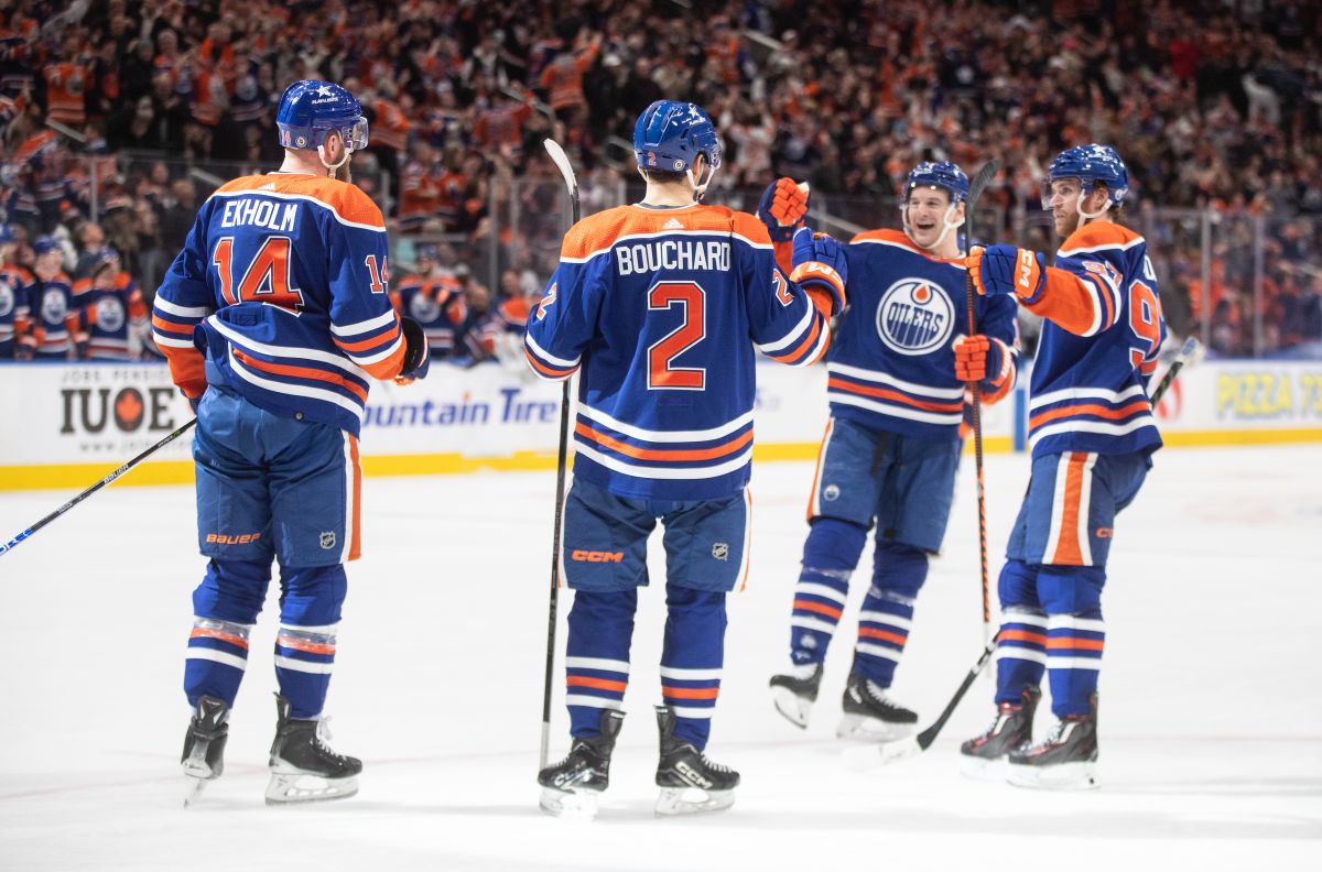 Edmonton Oilers' Mattias Ekholm (14), Evan Bouchard (2), Zach Hyman (18) and Connor McDavid (97) celebrate a goal against the Toronto Maple Leafs during third period NHL action in Edmonton on Tuesday January 16, 2024.