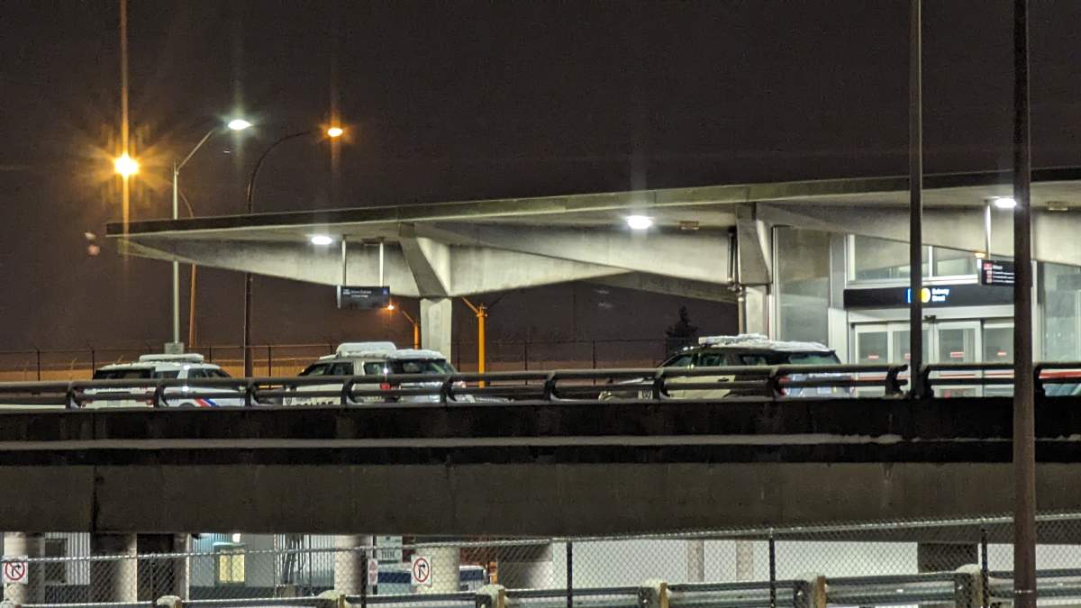 Police cruisers parked at Toronto's Wilson subway station, where a double stabbing was reported.
