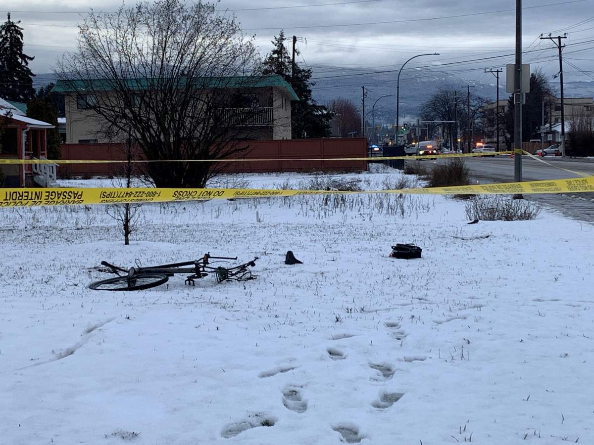 Police tape surrounds a bicycle in the snow on Monday morning along Rutland Road.
