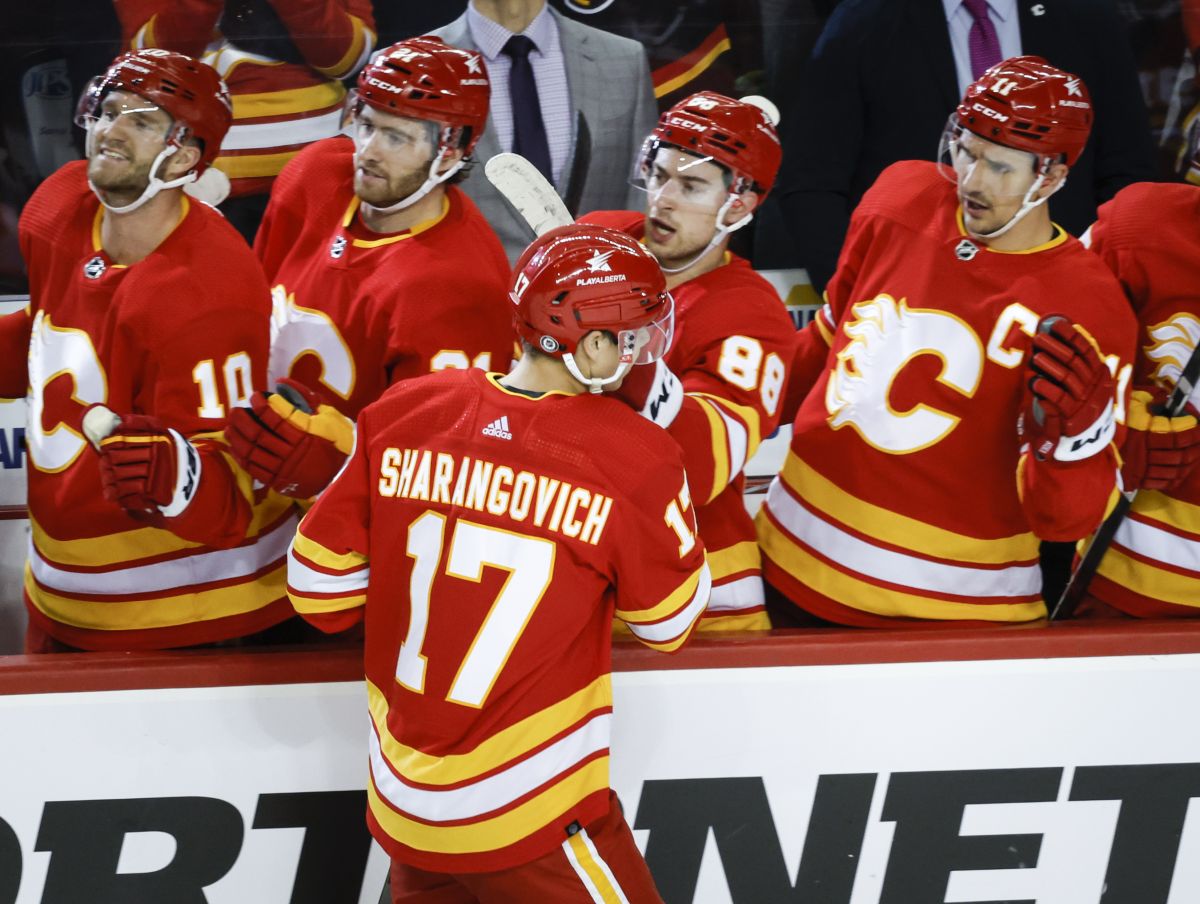 Calgary Flames forward Yegor Sharangovich (17) celebrates his goal with teammates during third period NHL hockey action against the Los Angeles Kings in Calgary, Tuesday, Feb. 27, 2024.