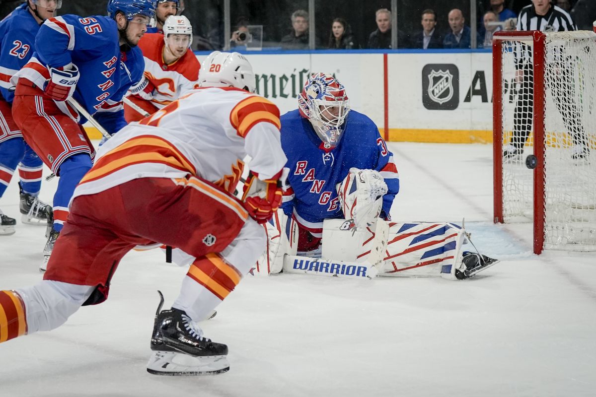 New York Rangers goaltender Igor Shesterkin blocks the shot of Calgary Flames forward Blake Coleman during the third period an NHL hockey game on Monday, Feb. 12, 2024, in New York.