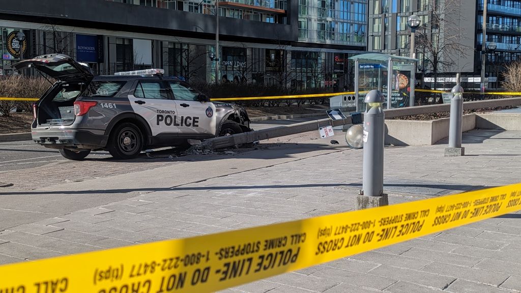 Toronto police officer sent to hospital after crashing into light pole