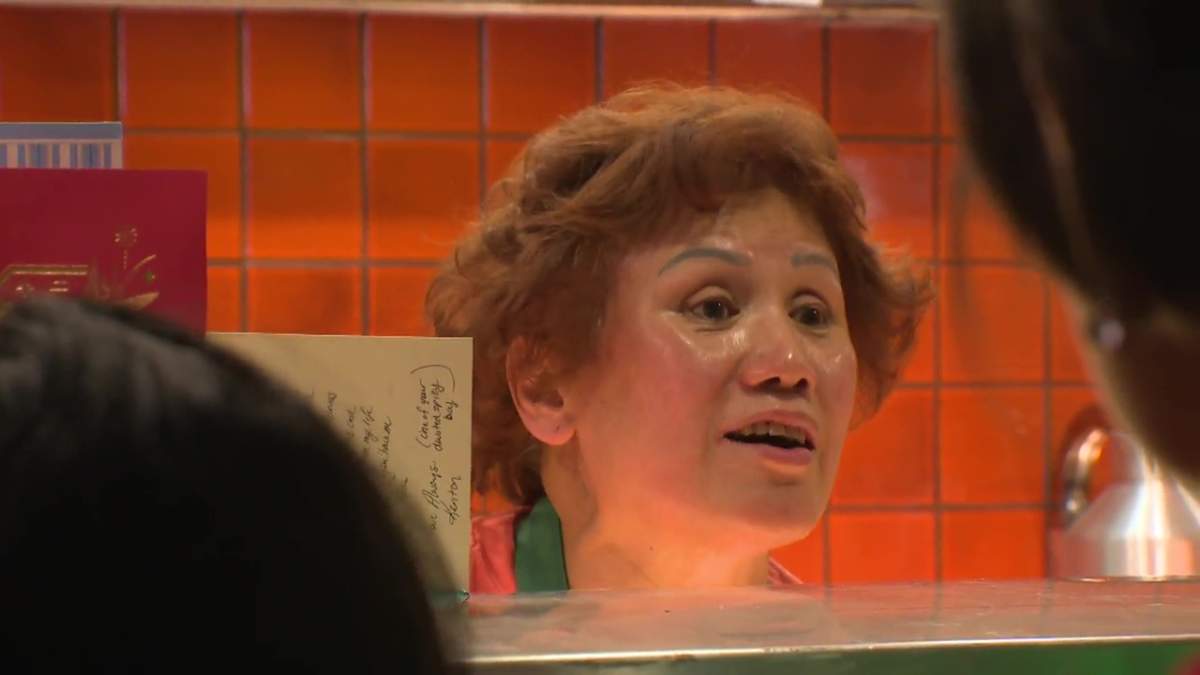 Amy Quon serving customers at the Chicken for Lunch eatery in the food court at Rice Howard Place in downtown Edmonton on Wednesday, February 28, 2024.