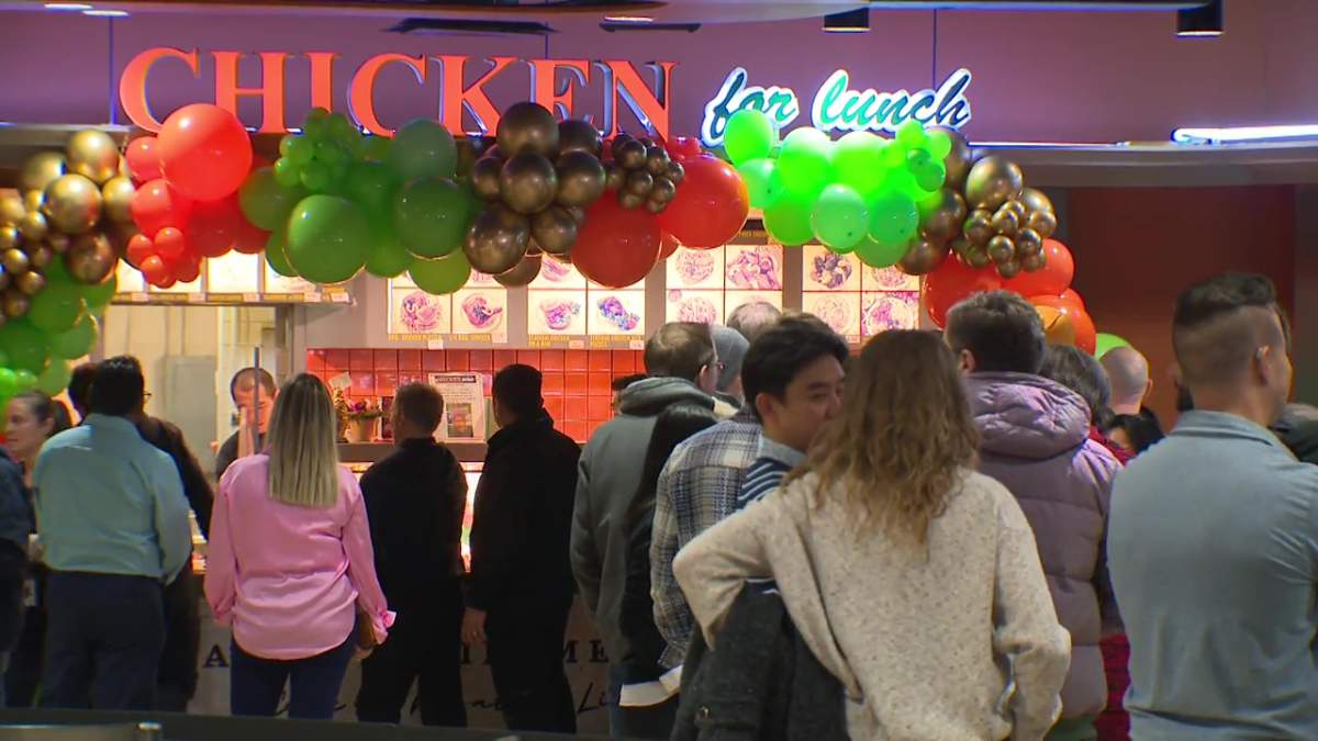 Amy Quon serving customers at the Chicken for Lunch eatery in the food court at Rice Howard Place in downtown Edmonton on Wednesday, February 28, 2024.
