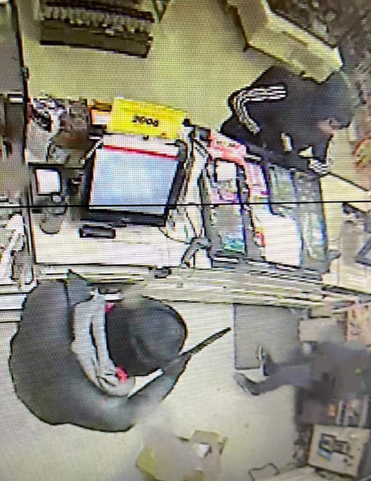 RCMP officers are looking for two men suspected in a robbery at a business in Portage la Prairie, Man., on Feb. 16, 2024.