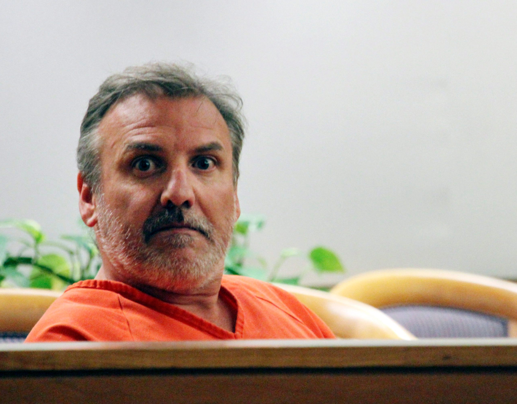 Brian Steven Smith looks out in the courtroom while waiting for his arraignment to start in Anchorage, Alaska.