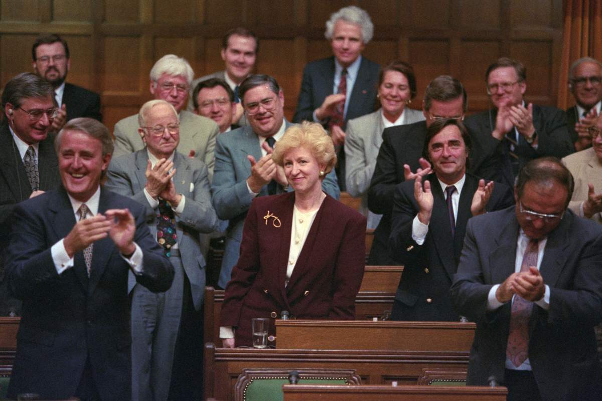 Leader of the Conservative Party and prime minister-designate Kim Campbell is given a standing ovation in the House of Commons by Prime Minister Brian Mulroney and other members of the government, Ottawa, Wednesday, June 16, 1993. THE CANADIAN PRESS/Tom Hanson