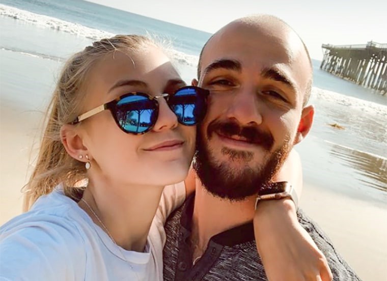 Gabby Petito and Brian Laundrie. She is wearing sunglasses and her arm is around Laundrie's neck.